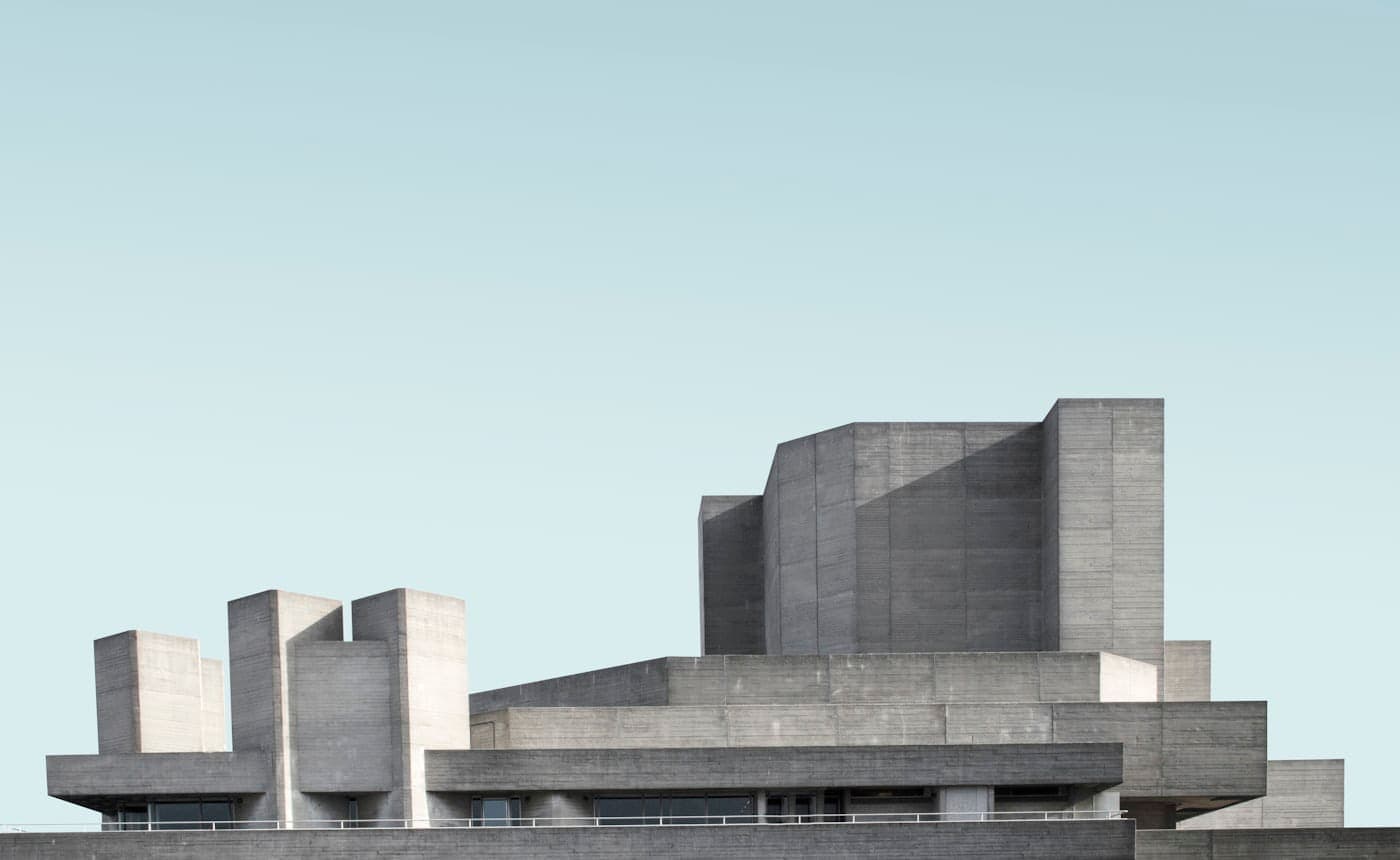 Landscape view of a grey concrete brutalist building facade