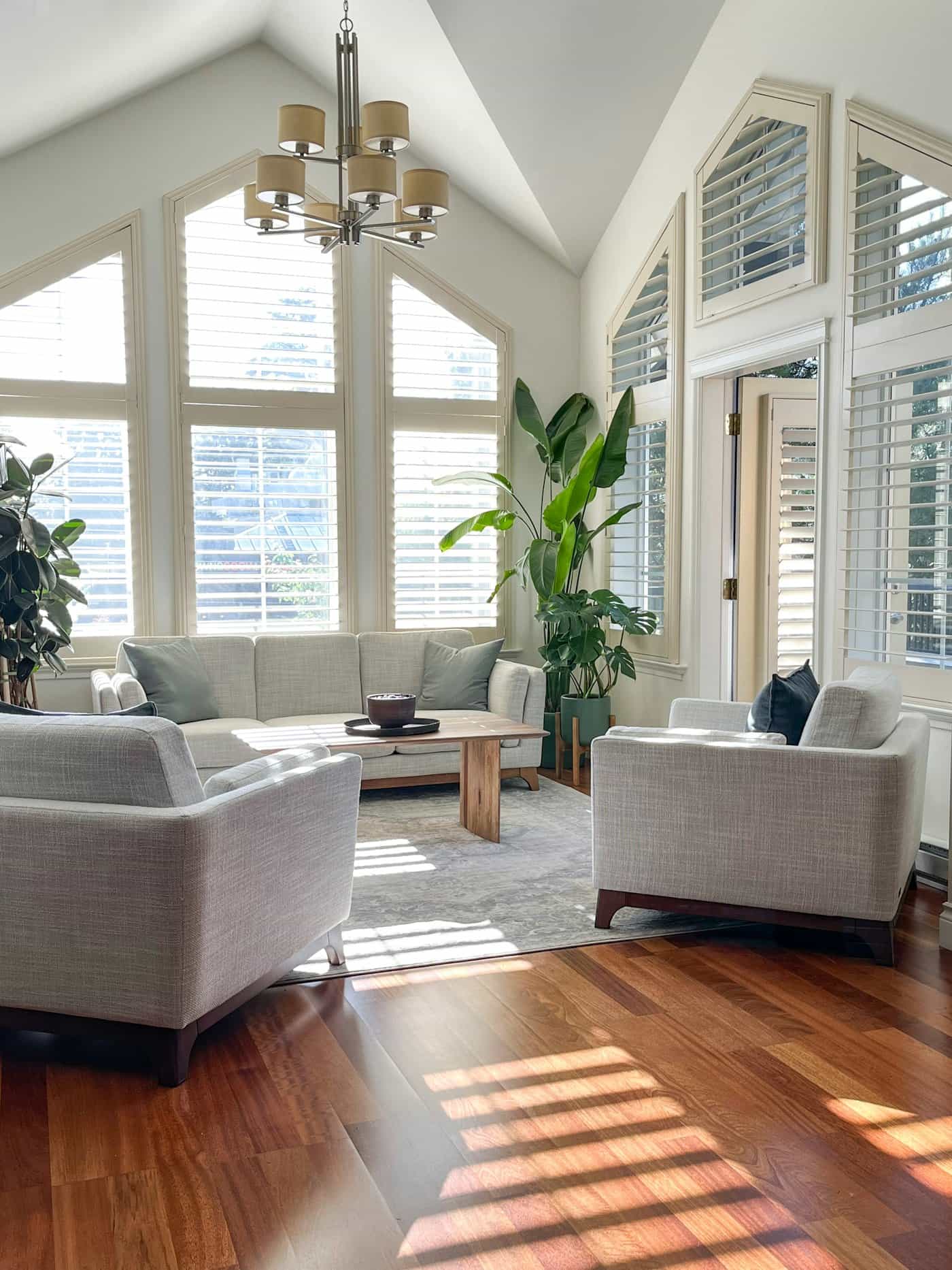 Calm living room interior flooded with light from a large window